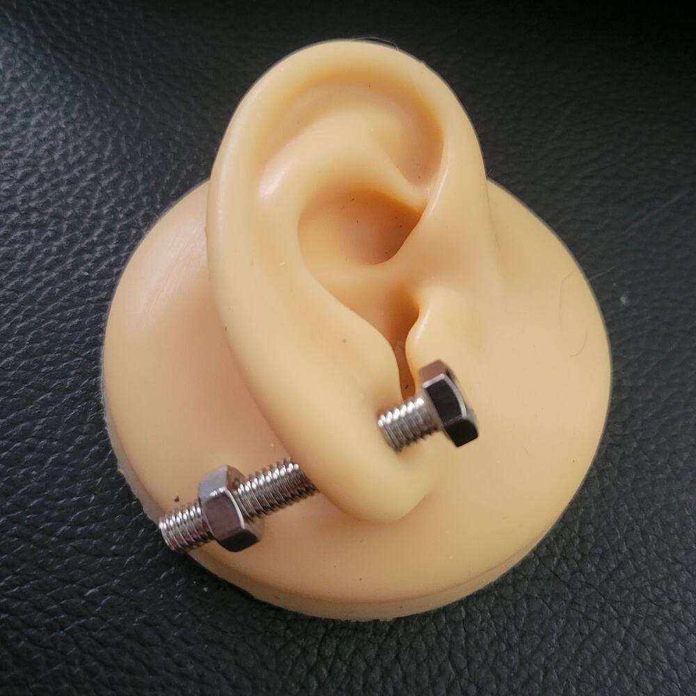 Silver nut and bolt shaped illusion post earrings